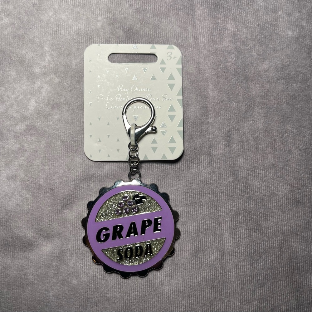 DISNEY GRAPE SODA CAP WITH CRYSTALS FROM PIXAR UP MOVIE BAG CHARM KEYCHAIN NEW